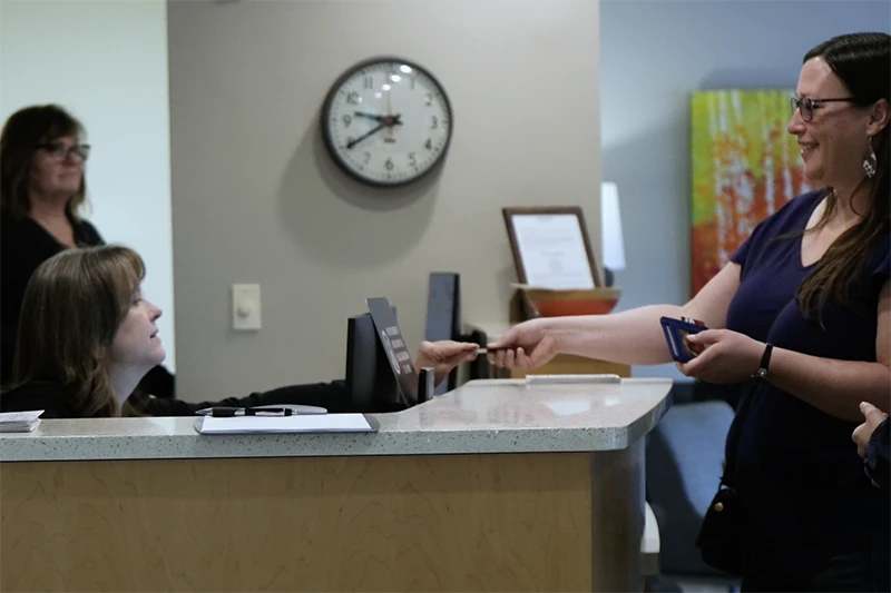 Patient paying at reception Patient paying at reception